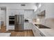 Modern kitchen with stainless steel appliances and white cabinets at 26646 N 46Th Pl, Cave Creek, AZ 85331