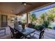 Outdoor patio with dining furniture and lush landscaping at 26646 N 46Th Pl, Cave Creek, AZ 85331