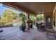 Covered patio with seating area, overlooking a sparkling pool at 26646 N 46Th Pl, Cave Creek, AZ 85331