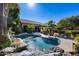 Inviting kidney-shaped pool with waterfall feature and spacious backyard at 26646 N 46Th Pl, Cave Creek, AZ 85331