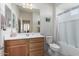 Simple bathroom with a toilet, bathtub, and vanity at 27606 W Tonopah Dr, Buckeye, AZ 85396