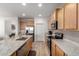 Well-equipped kitchen featuring ample cabinetry and granite countertops at 27606 W Tonopah Dr, Buckeye, AZ 85396