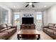 Living room with two brown sofas and a coffee table at 27606 W Tonopah Dr, Buckeye, AZ 85396