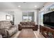 Bright living room featuring comfortable seating and large windows at 27606 W Tonopah Dr, Buckeye, AZ 85396