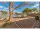 Landscaped backyard with lake view and gravel at 2805 N 111Th Dr, Avondale, AZ 85392