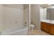 Clean bathroom with shower/tub combo and wood cabinets at 2805 N 111Th Dr, Avondale, AZ 85392