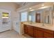 Bathroom with double vanity, large mirror, and tub at 2805 N 111Th Dr, Avondale, AZ 85392