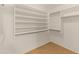 Large walk-in closet with shelving and hanging rods at 2805 N 111Th Dr, Avondale, AZ 85392