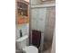 Bathroom with shower stall and wood cabinet at 302 E Beech Ave, Casa Grande, AZ 85122