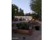 Landscaped backyard with garden and patio area at night at 3036 W Gail Rd, Phoenix, AZ 85029