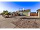 House exterior showcasing desert landscaping and a large driveway at 3036 W Gail Rd, Phoenix, AZ 85029