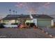 White single story home with solar panels and landscaping at 3036 W Gail Rd, Phoenix, AZ 85029