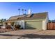 Single-story home with solar panels and a two-car garage at 3036 W Gail Rd, Phoenix, AZ 85029