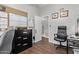 Bright home office features a desk, chair, and built-in shelving at 3036 W Gail Rd, Phoenix, AZ 85029