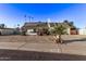 Single story house with solar panels and gravel yard at 3036 W Gail Rd, Phoenix, AZ 85029