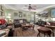 Relaxing living room with brown leather furniture and wood floors at 3036 W Gail Rd, Phoenix, AZ 85029