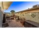 Inviting patio with fire pit, wicker furniture, and potted plants at 3036 W Gail Rd, Phoenix, AZ 85029