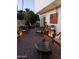 Evening ambiance of a patio with wicker furniture and lighting at 3036 W Gail Rd, Phoenix, AZ 85029