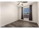 Bedroom with wood-look floors and a window at 305 S Val Vista Dr # 71, Mesa, AZ 85204