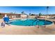 Inviting kidney-shaped pool with a pool lift for accessibility at 305 S Val Vista Dr # 71, Mesa, AZ 85204