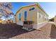 Side view of the home showcasing the AC unit and exterior siding at 305 S Val Vista Dr # 71, Mesa, AZ 85204