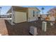 View of the back of the home, carport, and shed from the backyard at 305 S Val Vista Dr # 71, Mesa, AZ 85204