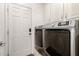 Laundry room with washer, dryer, and cabinets at 305 S Val Vista Dr # 71, Mesa, AZ 85204