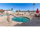 Inviting spa with poolside lounge chairs and patio tables at 305 S Val Vista Dr # 71, Mesa, AZ 85204