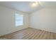 Bright bedroom with laminate flooring and window coverings at 3100 W Quail Rd, Eloy, AZ 85131