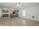 Open living area with laminate flooring and ceiling fan at 3100 W Quail Rd, Eloy, AZ 85131