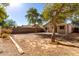 Large backyard with mature trees and grassy area at 34717 N Picket Post Dr, Queen Creek, AZ 85142