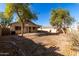 Landscaped backyard with a large grassy area at 34717 N Picket Post Dr, Queen Creek, AZ 85142