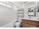 Clean bathroom with shower/tub combo and wood vanity at 34717 N Picket Post Dr, Queen Creek, AZ 85142