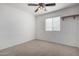 Spacious bedroom with ceiling fan and window coverings at 34717 N Picket Post Dr, Queen Creek, AZ 85142