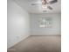 Spacious bedroom featuring a ceiling fan and large window at 34717 N Picket Post Dr, Queen Creek, AZ 85142