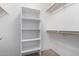 Well-organized closet with ample shelving and hanging space at 34717 N Picket Post Dr, Queen Creek, AZ 85142