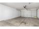 Spacious garage with overhead door and ample storage space at 34717 N Picket Post Dr, Queen Creek, AZ 85142