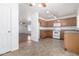 Kitchen with oak cabinets, tile floors, and white appliances at 34717 N Picket Post Dr, Queen Creek, AZ 85142