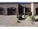 Tan stucco exterior with two-car garage and desert landscaping at 4241 N Pebble Creek Pkwy # 13, Goodyear, AZ 85395