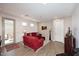 Living room with red couches and wood-look floors at 4249 E Sagebrush St, Gilbert, AZ 85296