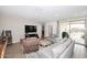 Living room with gray sofas and access to backyard at 4249 E Sagebrush St, Gilbert, AZ 85296