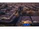 Aerial view of a residential neighborhood with houses and a pool at dusk at 4552 S Flare --, Mesa, AZ 85212