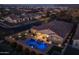 Aerial perspective of home with illuminated pool at 4552 S Flare --, Mesa, AZ 85212