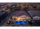 Night view of home, pool, and surrounding neighborhood at 4552 S Flare --, Mesa, AZ 85212