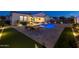 Stunning backyard with a pool, spa, putting green, and patio at 4552 S Flare --, Mesa, AZ 85212