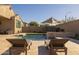 Private backyard retreat with a sparkling pool and comfortable lounge chairs at 4552 S Flare --, Mesa, AZ 85212