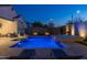 Stunning backyard oasis featuring a sparkling pool, spa, and relaxing patio area at 4552 S Flare --, Mesa, AZ 85212