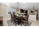 Bright dining room features a large table with seating for six and a modern light fixture at 4552 S Flare --, Mesa, AZ 85212