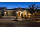 Front view of a home with a two-car garage and brick walkway at 4552 S Flare --, Mesa, AZ 85212