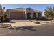 Front view of a single-story home with attached garage at 4552 S Flare --, Mesa, AZ 85212